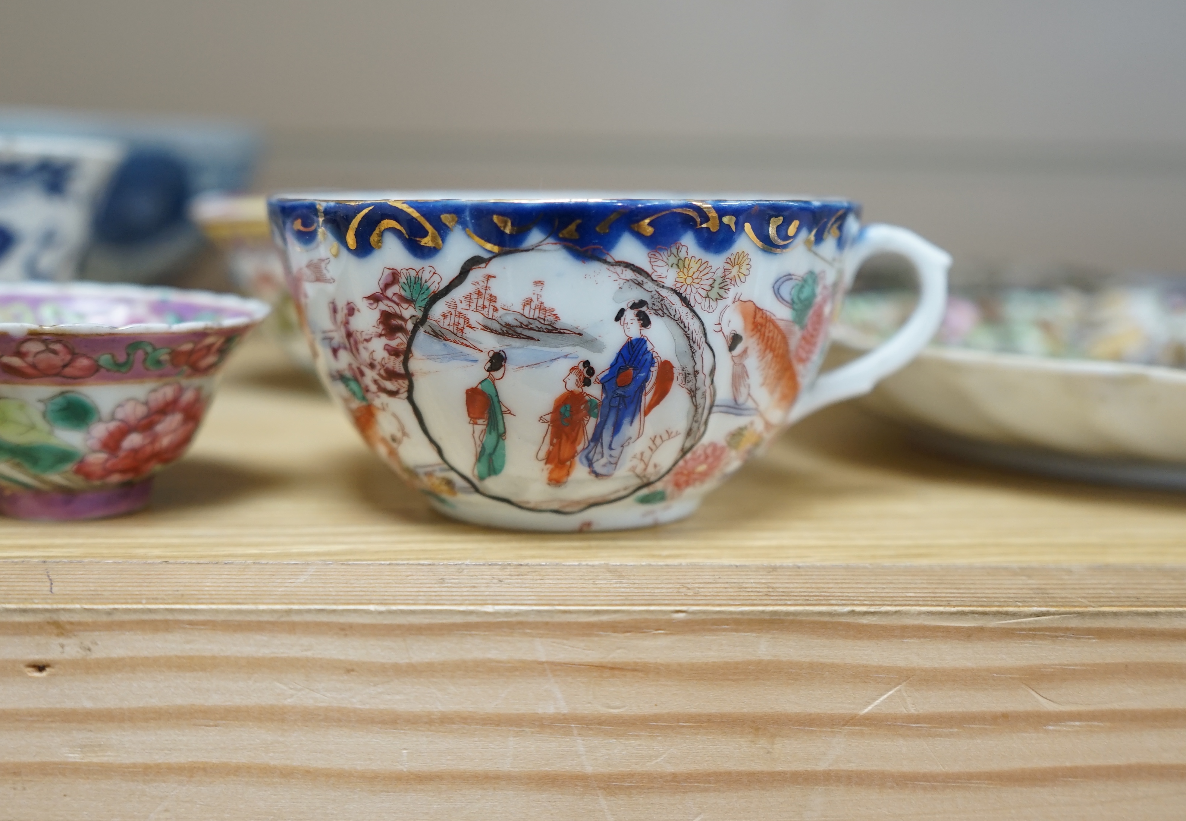 A quantity of Chinese and Japanese porcelain to include blue and white bowls, famille rose tea bowls and a pair of late 19th century dishes (18). Condition - varies, poor to fair